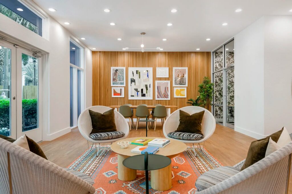 clubhouse seating area with chairs and business center in the back