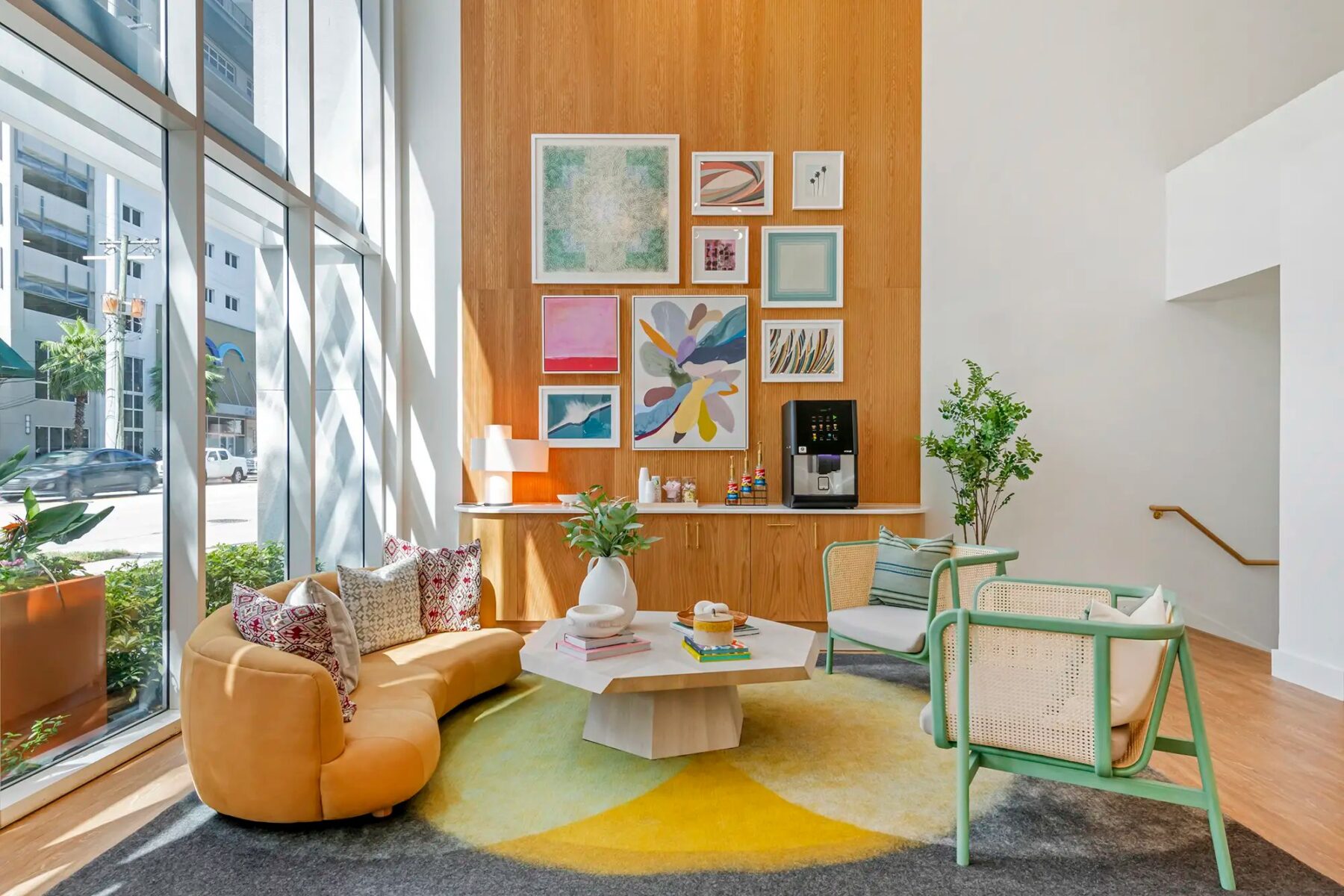 Leasing office waiting area with couch and chairs and coffee maker
