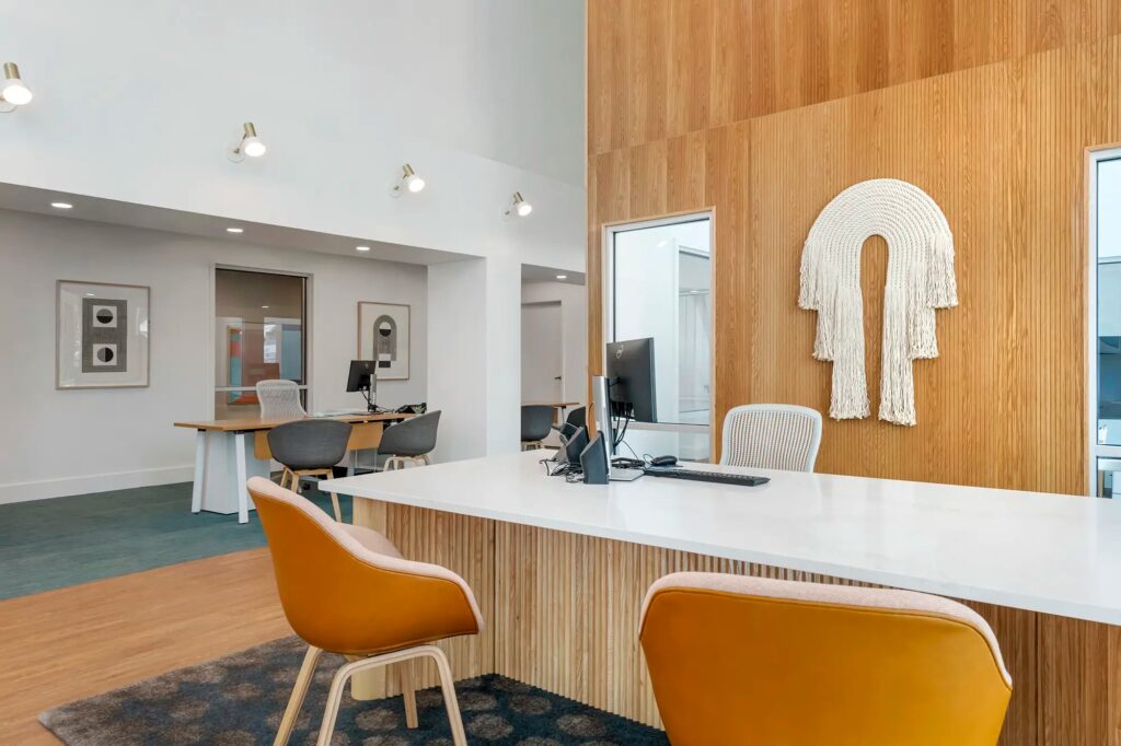 Leasing office property employees desks with more desks to the left