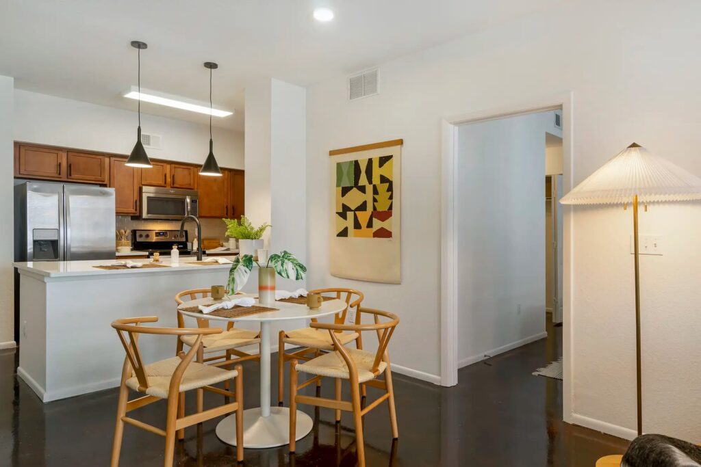 dining room and kitchen with stainless steel appliances