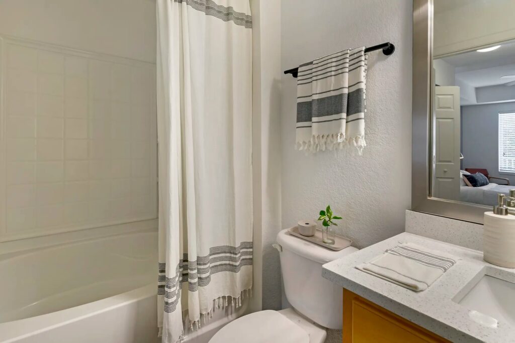 Bathroom with large mirror